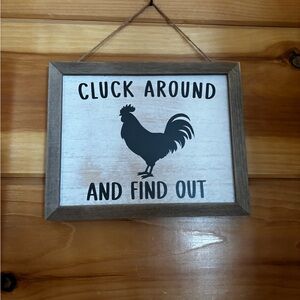 Cluck around rooster sign